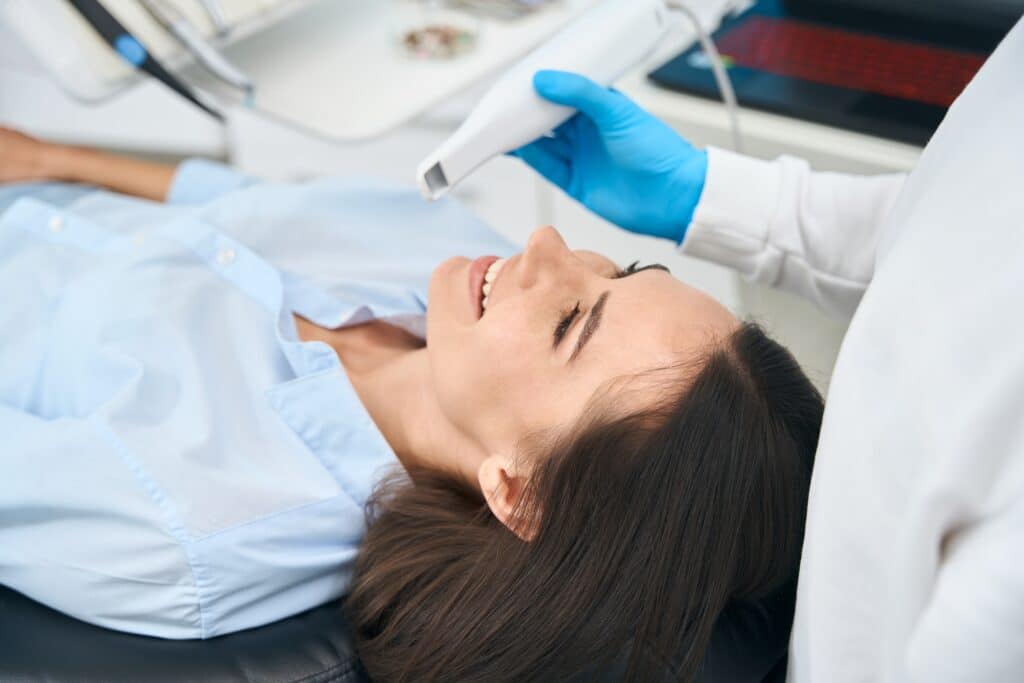 Dentist,Checking,Female,Client,Mouth,Health,With,Dental,Intraoral,Camera
